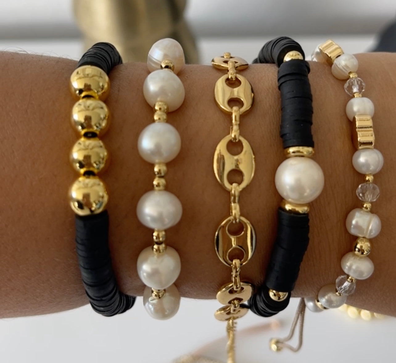 Bracelet stack black & gold